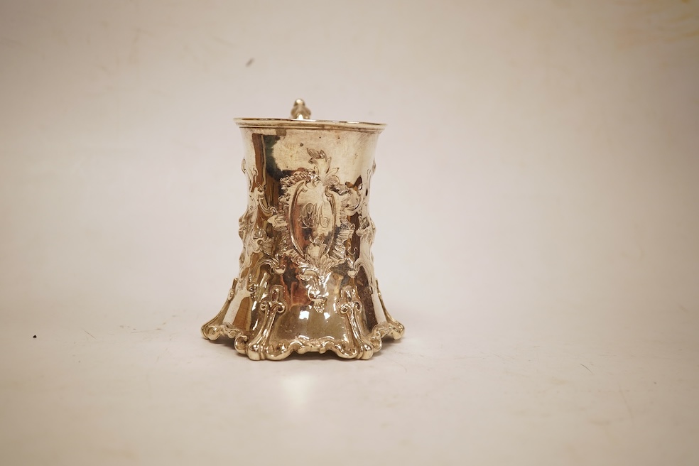 A Victorian embossed silver christening mug, of waisted form, by John Keith, London, 1851, height 10.2cm, 5.8oz.
